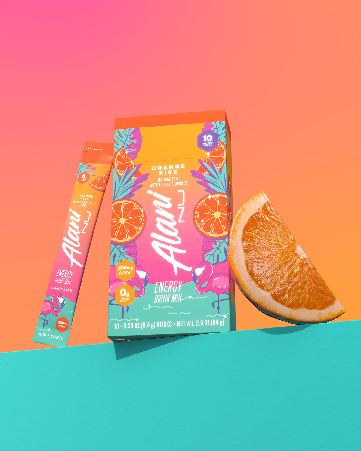 An orange wedge, an Orange Kiss Energy Stick, and its 10-pack carton grouped on a seafoam shelf.