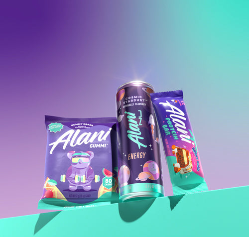 A shelf with three Alani Nu staples—a pouch of Gummy Bears, a Cosmic Stardust Energy Drink, and a Rocky Road Protein Bar. 