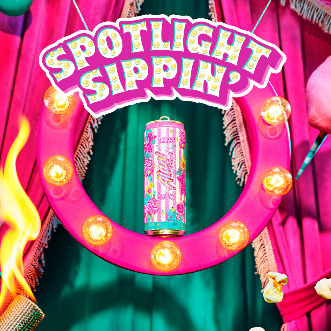 A can of Cotton Candy Alani Nu dazzling center-ring during a high-energy juggling act. Text reads, "Spotlight Sippin'; Shop The Spin."
