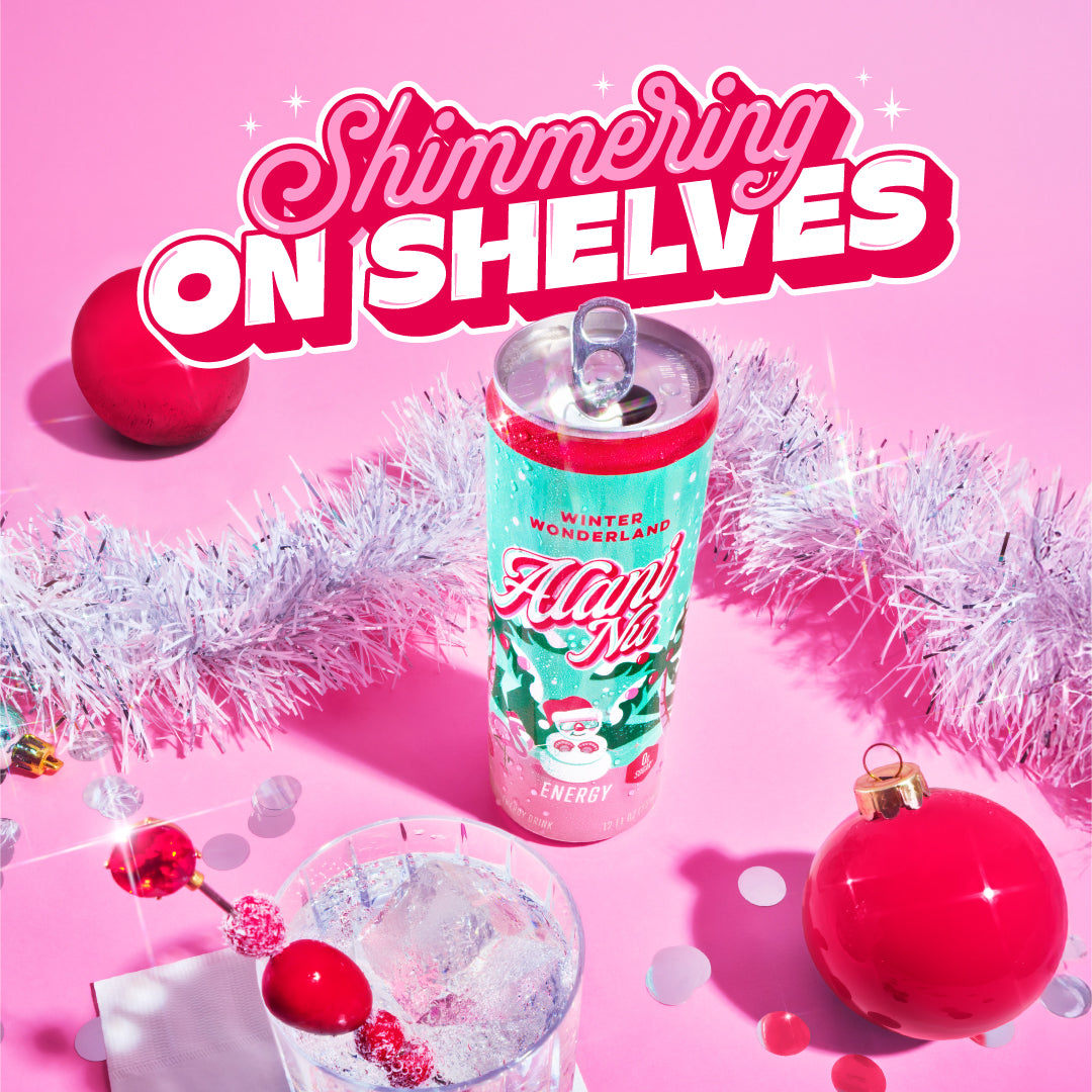 Alani Nu's holiday Energy Drink surrounded by tinsel and poured into a glass garnished with cranberries and sugar plums. Text reads, “Shimmering On Shelves.” Click to find.