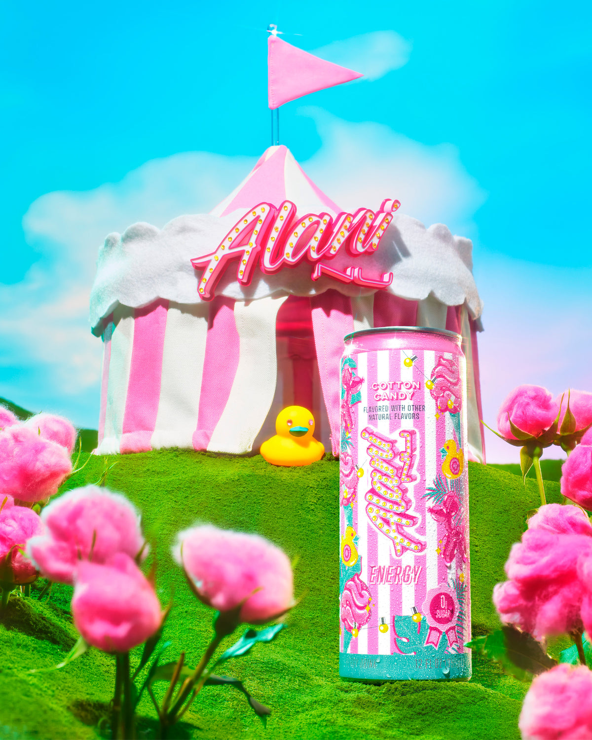 A larger-than-life Cotton Candy Alani Energy masquerading as a big-top circus tent on a surreal hillscape. Pink glass balloon dogs fill the frame.
