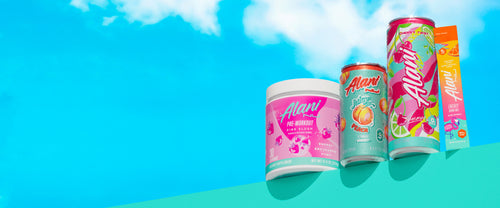 Alani Nu's Pink Slush Pre-Workout, Mini Juicy Peach Energy, Cherry Twist Energy, and an Orange Kiss Energy Stick on a shelf before a bright blue sky.