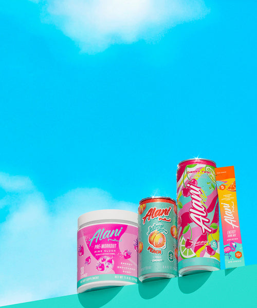 Alani Nu's Pink Slush Pre-Workout, Mini Juicy Peach Energy, Cherry Twist Energy, and an Orange Kiss Energy Stick on a shelf before a bright blue sky.