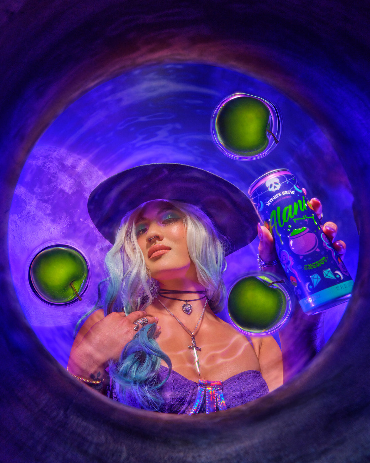 A woman engaging with Witch&#39;s Brew Energy Drink while looking at apples.