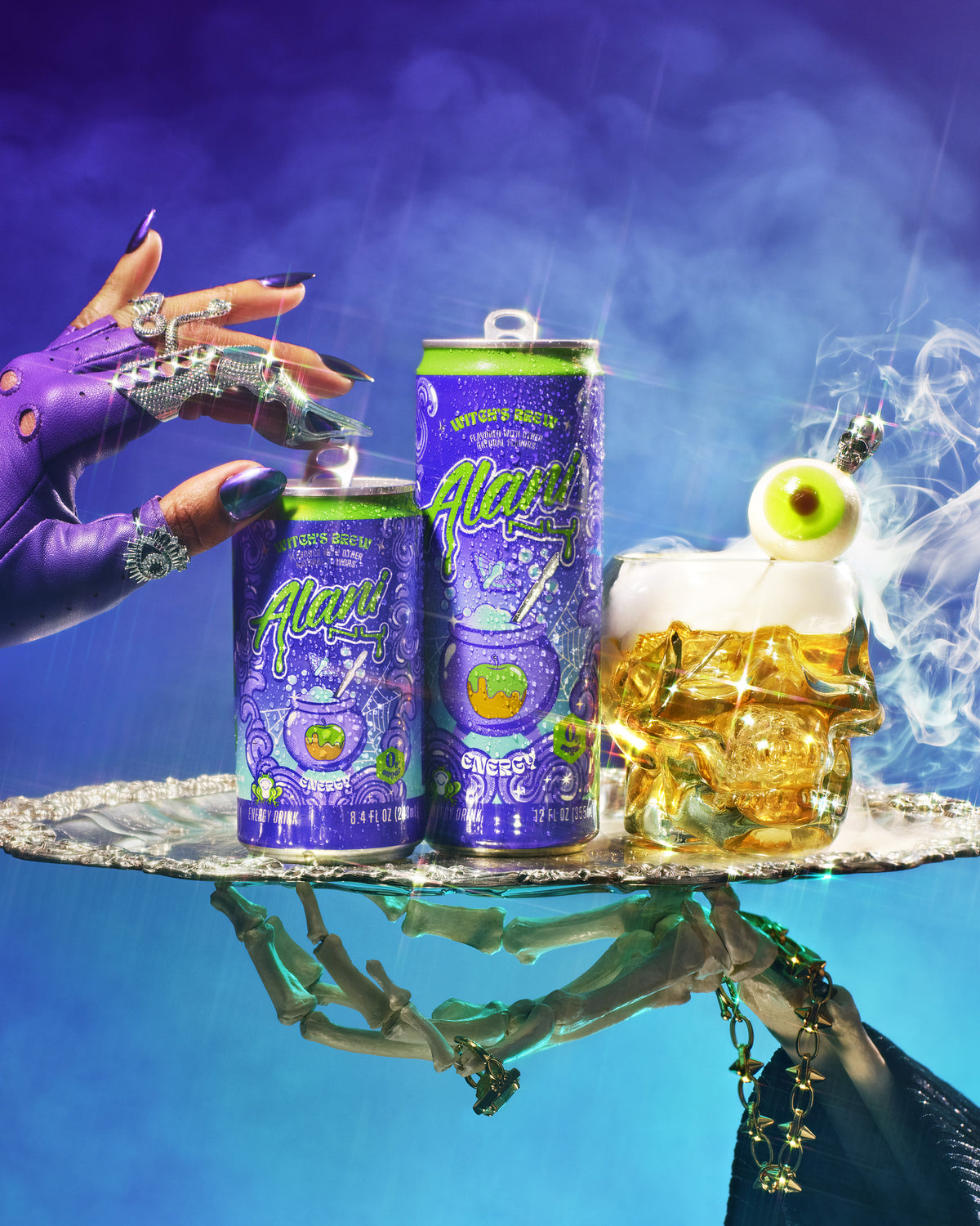 Alani Nu&#39;s new caramel-appled-flavored Mini Energy caught in a bejeweled spiderweb with colorful moths. 
