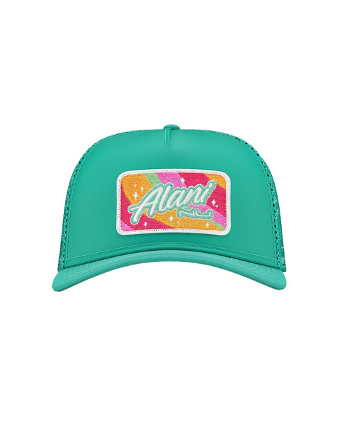 Alani’s exclusive Sherbet Swirl Trucker Hat shown in a dreamy cloudscape featuring a rainbow and a pool of water with floating orange slices. 