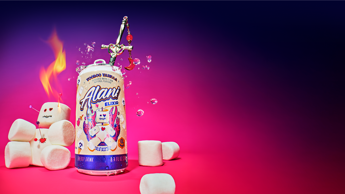 A mini can of Alani Voodoo Vanilla Energy Elixir positioned to the left surrounded by floating water droplets, with a marshmallow creature character featuring push pins through it and flames from its head on one side, and additional marshmallows on the other, set against a deep purple to hot pink gradient background.