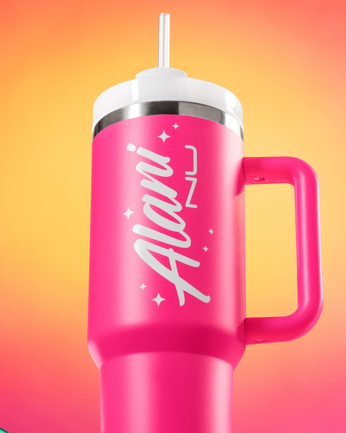 A pink travel tumbler with lid displayed standing upward. 