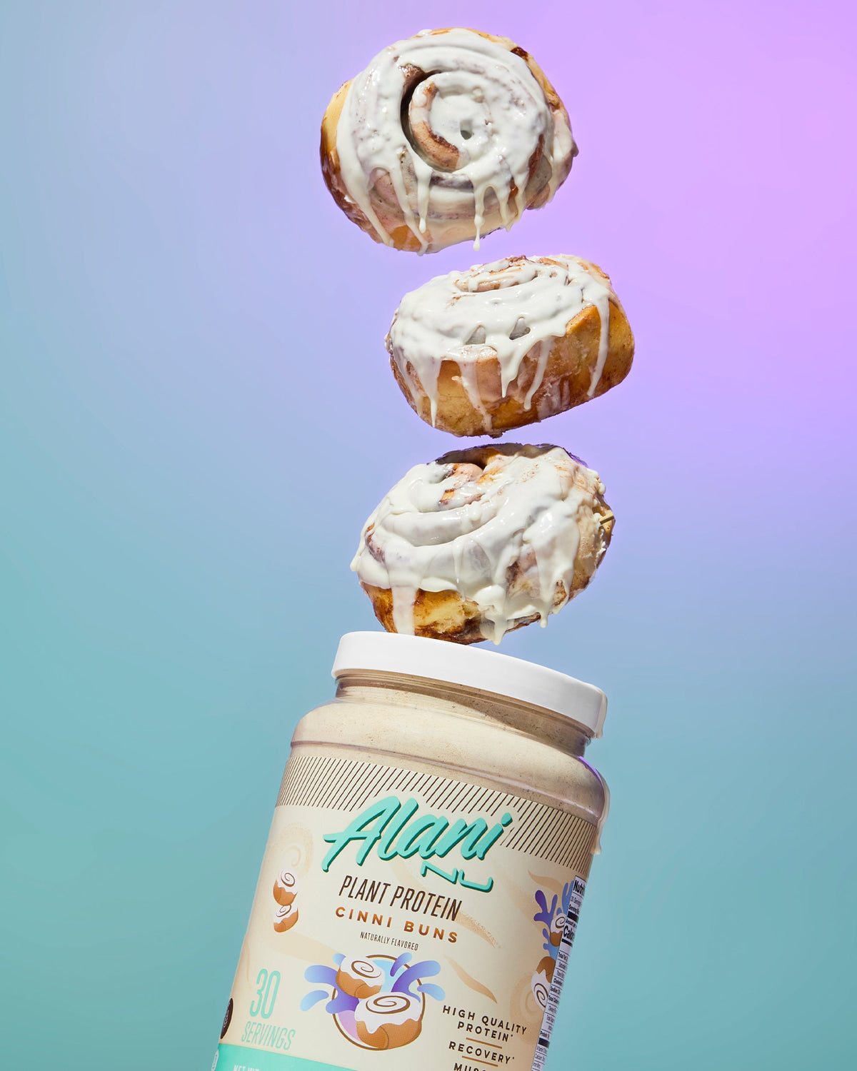 Plant Protein in Cinni Buns flavor with falling cinnamon rolls into the air.