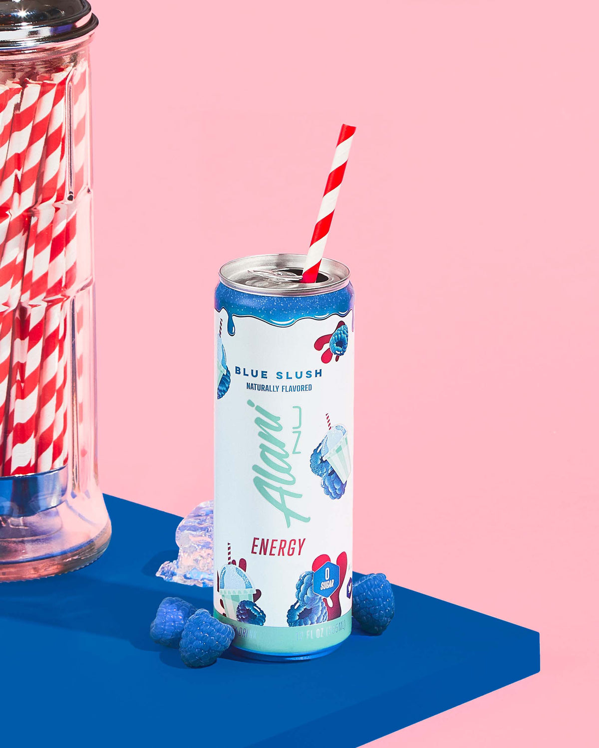 a pile of straws next to a can of Energy Drink - Blue Slush.