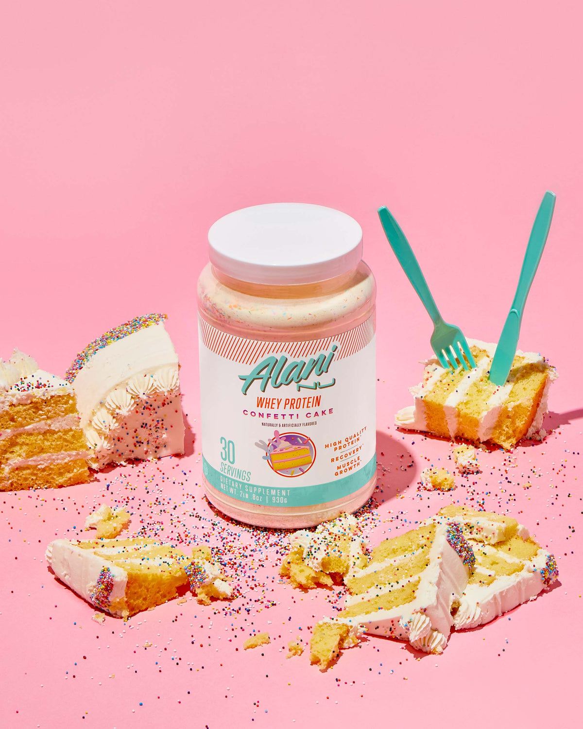 Whey Protein in Confetti Cake flavor next to pieces of cake.