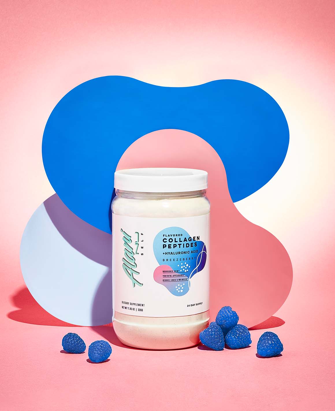 A 14-day supply container of Collagen Peptides in Breezeberry flavor sitting next to a pile of blueberries.