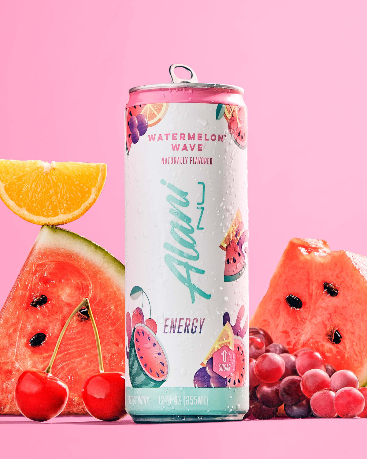 A Energy Drink in Watermelon Wave flavor next to tropical fruits.